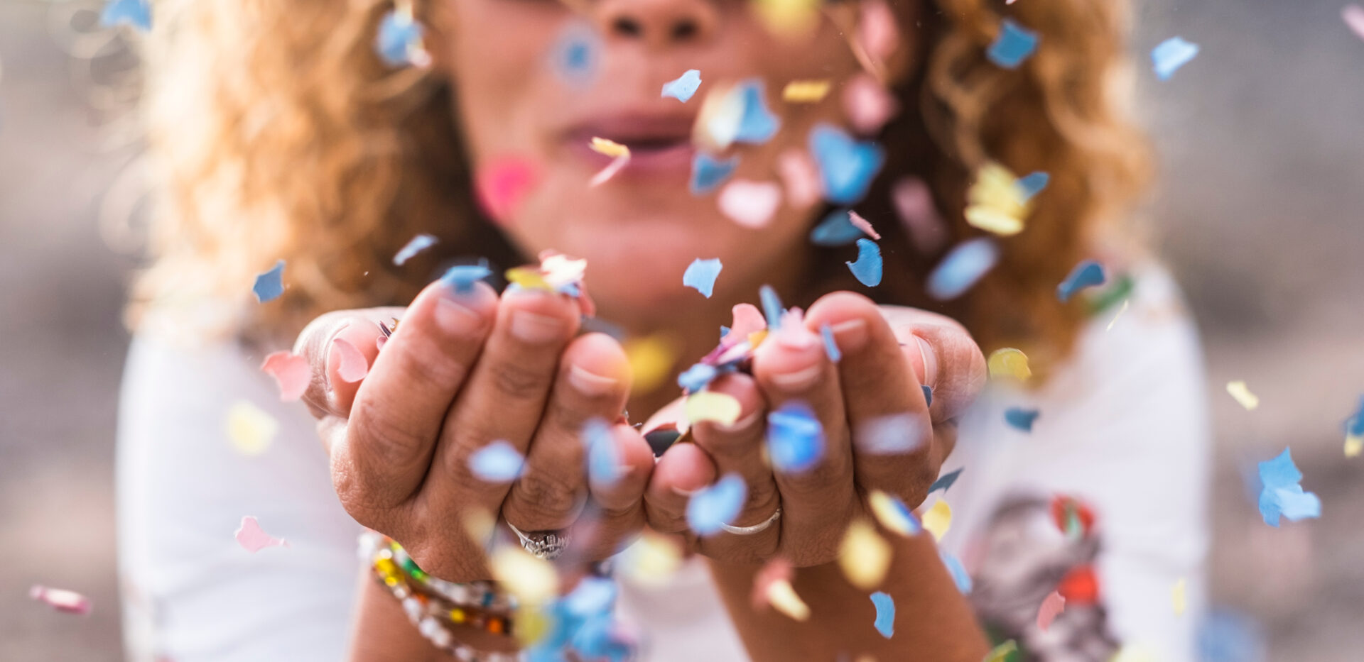 Beautiful,Defocused,Woman,Blow,Confetti,From,Hands.,Celebration,And,Event